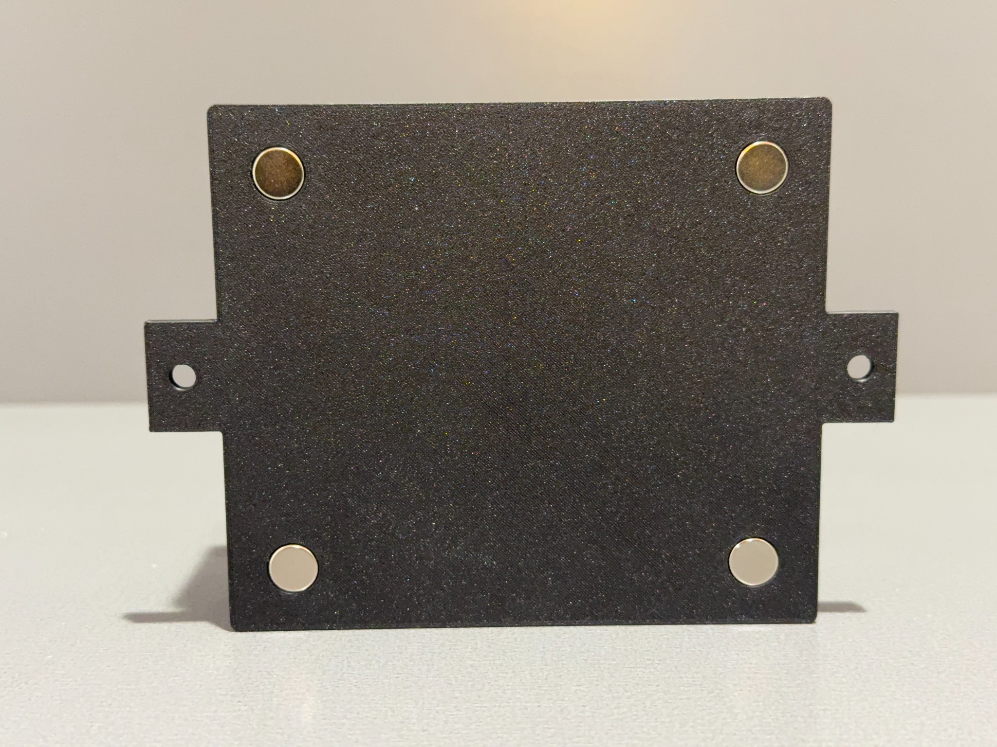 Bottom view of the Ranger family enclosure showing magnets and mounting tabs